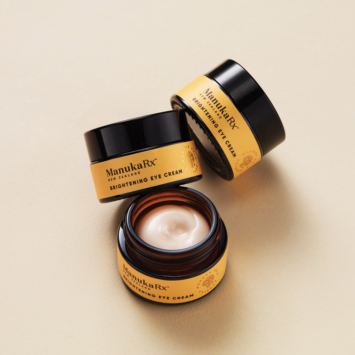 3 product jars of Manukax Brightening Eye Cream