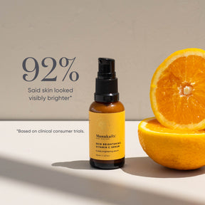 ManukaRx Skin Brightening Vitamin C Serum next to cut oranges